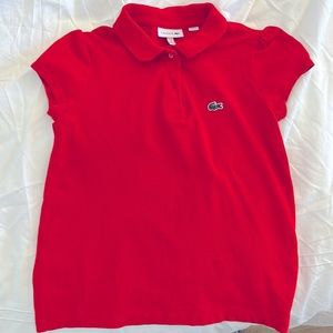 Lacoste polo shirt for girls. Size 8. Color is Red-orange. Only worn once.